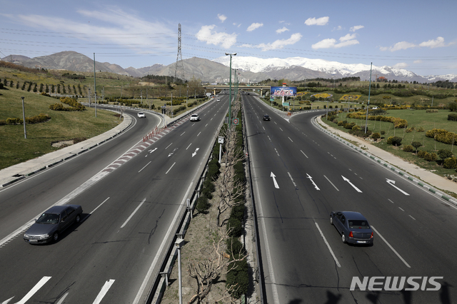 Cars drive in a highway in northern Tehran, Iran, Friday, March 20, 2020, on the first day of Iranian New Year, called Nowruz, or &quot;New Day&quot; in Farsi, the Persian holiday marking the the spring equinox. The new coronavirus has cut into the ancient Nowruz and has further slowed the Islamic Republic&#039;s economy. (AP Photo/Vahid Salemi)