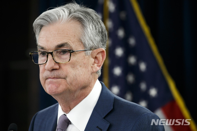 FILE - In this Tuesday, March 3, 2020 file photo, Federal Reserve Chair Jerome Powell pauses during a news conference to discuss an announcement from the Federal Open Market Committee, in Washington. In a series of sweeping steps, the U.S. Federal Reserve will lend to small and large businesses and local governments as well as extend its bond buying programs. The announcement Monday, March 23 is part of the Fed&#039;s ongoing efforts to support the flow of credit through an economy ravaged by the viral outbreak. (AP Photo/Jacquelyn Martin, File)