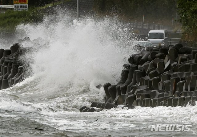 High waves pound the coast of the Kagoshima city, southwestern Japan Sunday, Sept. 6, 2020. The second powerful typhoon to slam Japan in a week unleashed fierce winds and rain on southern islands on Sunday, blowing off rooftops and leaving homes without power as it edged northward into an area vulnerable to flooding and mudslides. (Takuto Kaneko/Kyodo News via AP)