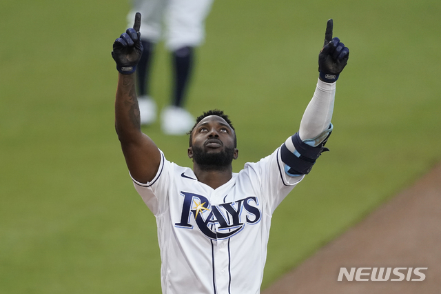 Tampa Bay Rays Randy Arozarena celebrates after hitting a two run home run against the Houston Astros during the first inning in Game 7 of a baseball American League Championship Series, Saturday, Oct. 17, 2020, in San Diego. (AP Photo/Ashley Landis)