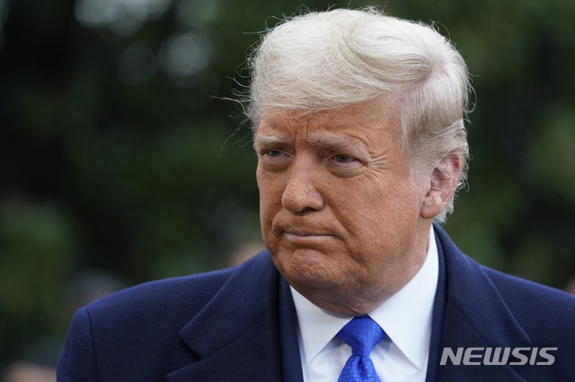 President Donald Trump speaks with reporters as he walks to Marine One on the South Lawn of the White House, Tuesday, Oct. 27, 2020, in Washington. (AP Photo/Alex Brandon)