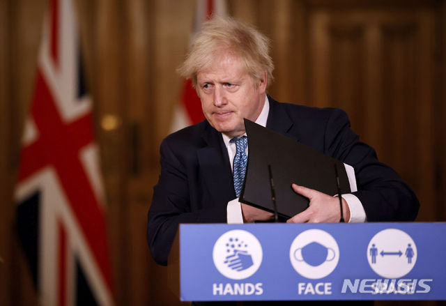 Britain&#039;s Prime Minister Boris Johnson speaks during a media briefing in Downing Street, London, Monday Dec. 21, 2020. (Tolga Akmen/Pool via AP)