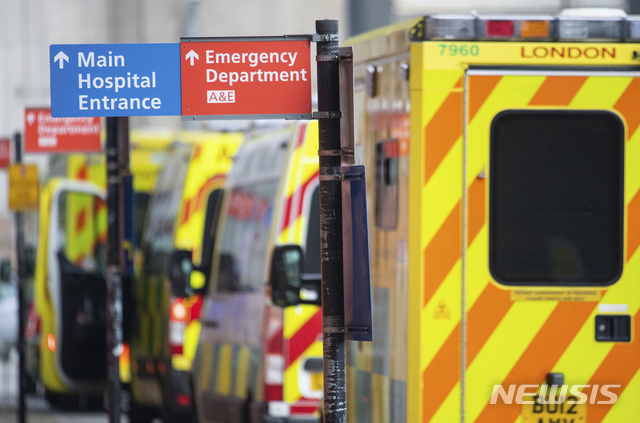 Ambulances outside the Royal London Hospital, in London, Tuesday Dec. 29, 2020. England Health Service figures show hospitals now have more Covid-19 patients than during April&#039;s first-wave peak, with fears of increased figures because of a Christmas social spread. (Dominic Lipinski/PA via AP)