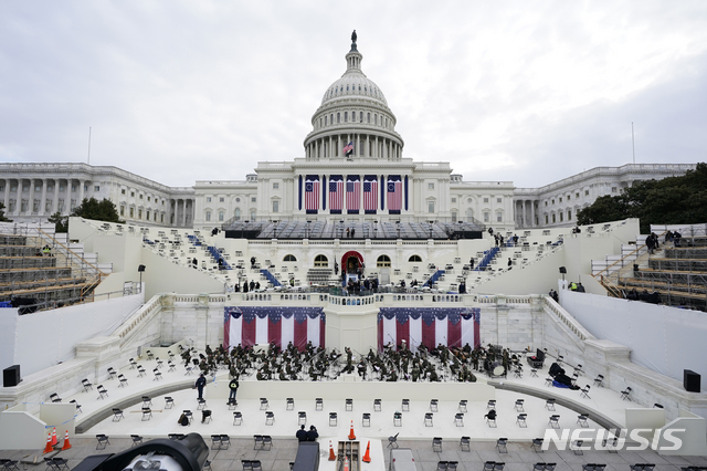 Preparations are made prior to a dress rehearsal for the 59th inaugural ceremony for President-elect Joe Biden and Vice President-elect Kamala Harris on Monday, January 18, 2021 at the U.S. Capitol in Washington. (AP Photo/Patrick Semansky, Pool)