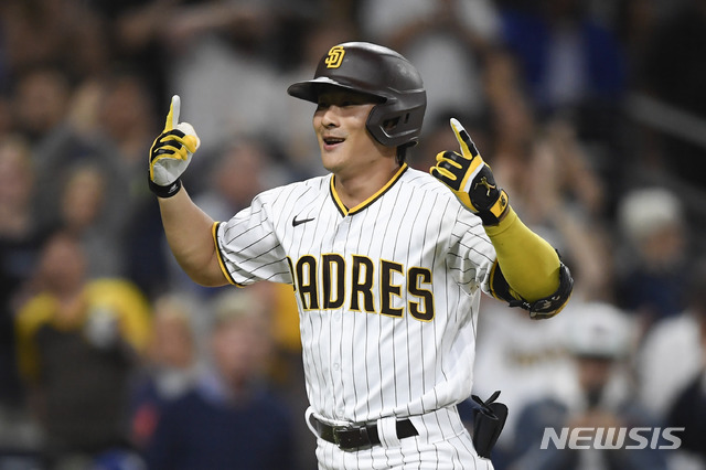 San Diego Padres second baseman Ha-Seong Kim (7) celebrates after hitting a solo home run during the fifth inning of a baseball game against Los Angeles Dodgers Tuesday, June 22, 2021, in San Diego. (AP Photo/Denis Poroy)
