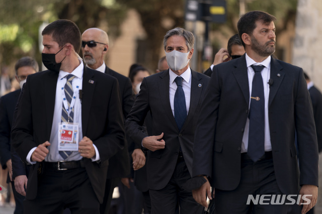 U.S. Secretary of State Antony Blinken, center, arrives at a G20 foreign ministers meeting in Matera, Italy, Tuesday, June 29, 2021. Blinken is on a week long trip in Europe traveling to Germany, France and Italy. (AP Photo/Andrew Harnik, Pool)