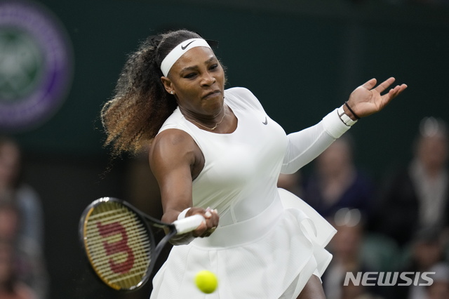 Serena Williams of the US plays a return to Aliaksandra Sasnovich of Belarus for the women&#039;s singles first round match on day two of the Wimbledon Tennis Championships in London, Tuesday June 29, 2021. (AP Photo/Kirsty Wigglesworth)