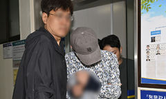 호송되는 나주 부부 살인 피의자